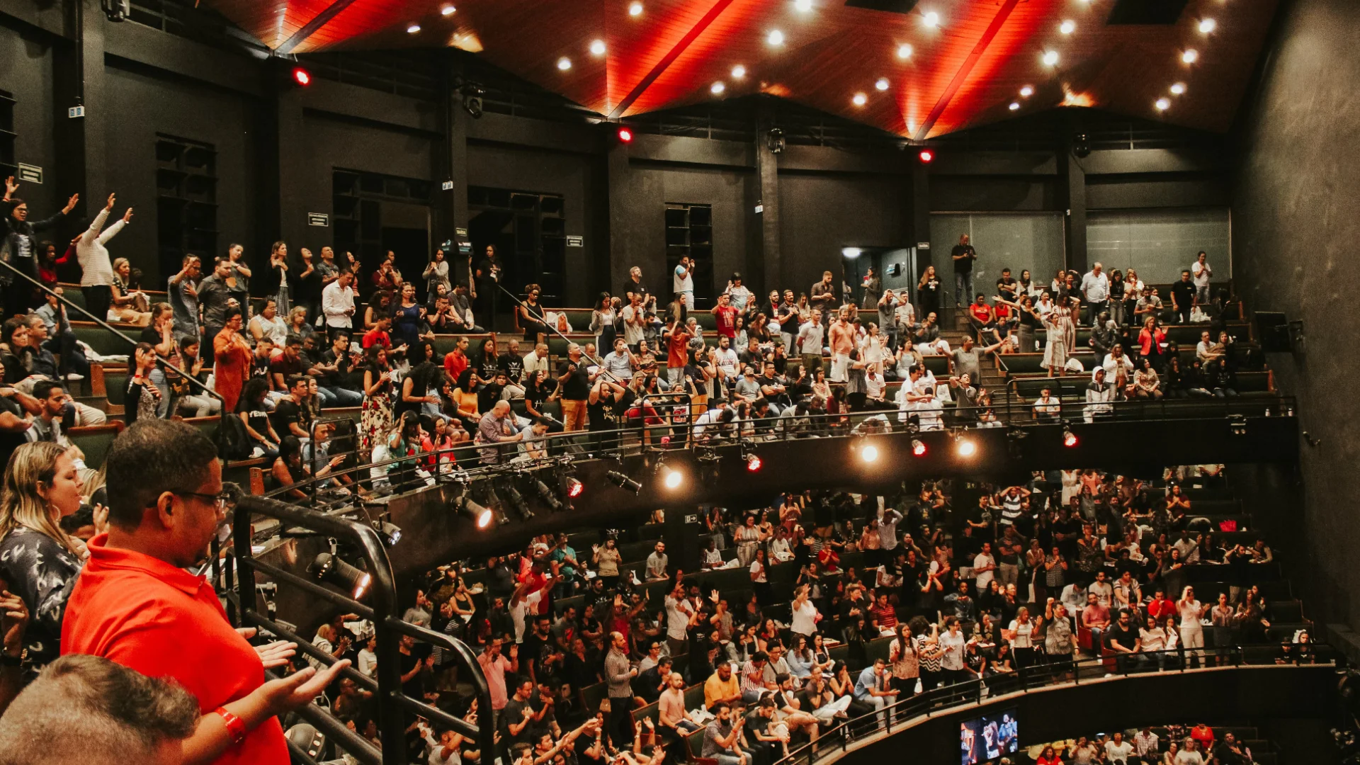 Conference hall filled with an applauding audience